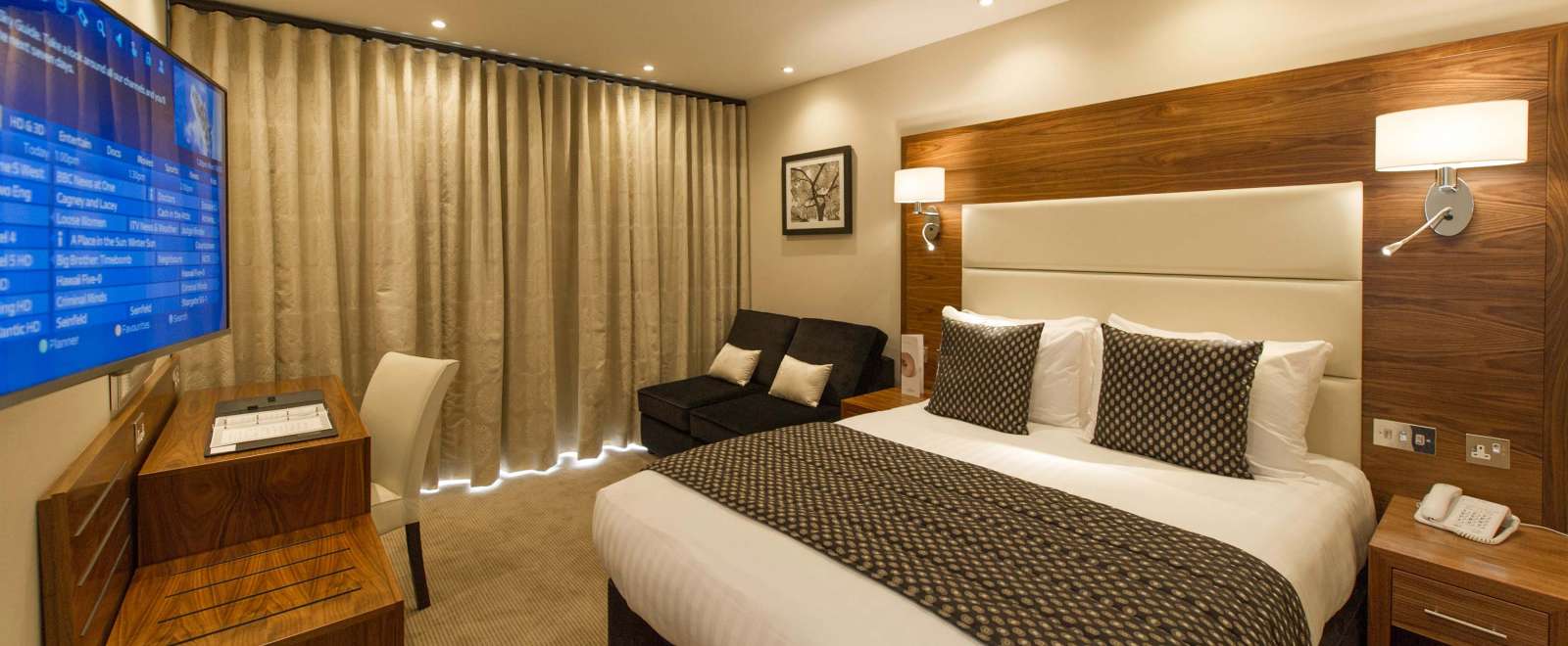 Devon Hotel Accommodation Bed with Seating Area and Closed Curtains